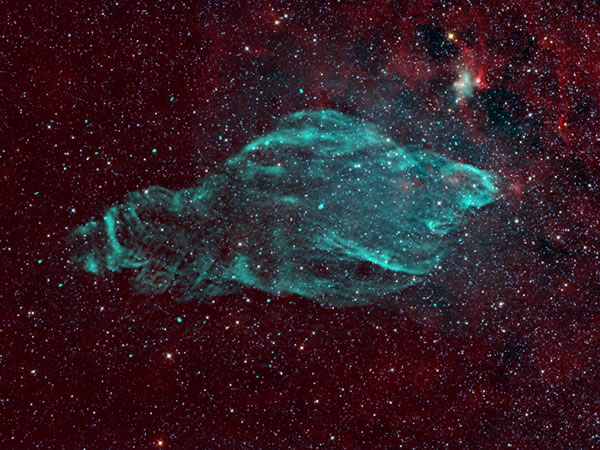 W50 supernova remnant in radio (green) against the infrared background of stars