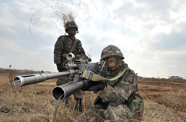 South Korean Army soldiers aim their weapons during a drill, as part of annual j