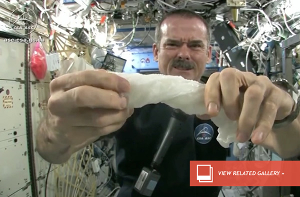 Expedition 35 commander Chris Hadfield gives a brief demonstration of fluid dyna