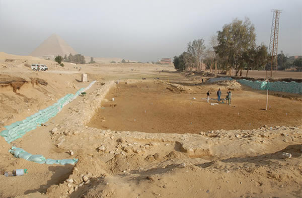 An image of the OK (Old Kingdom) Corral with the Giza pyramids in the distance.