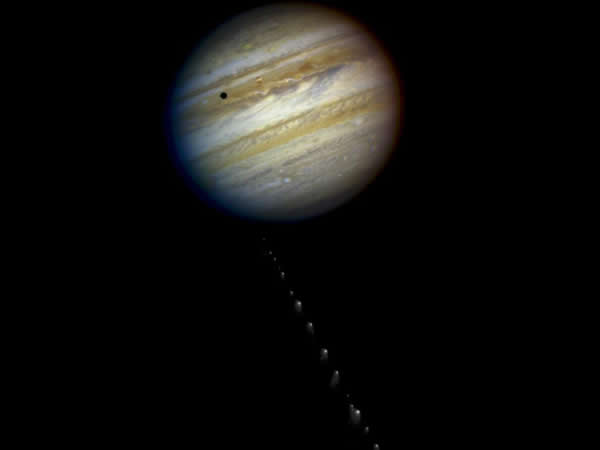 This is a composite photo, assembled from separate images of Jupiter and comet S