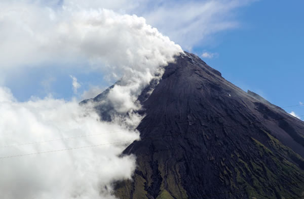 Volcano Mount Mayon spews a thick column of ash 500 metres (1,600 feet) into the