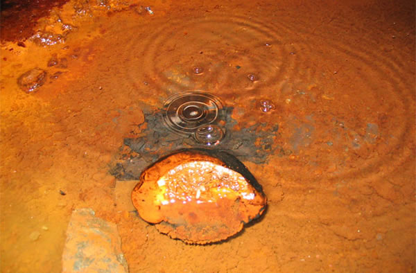Gas that bubbles out of the floor in a deep mine has a chemical composition that