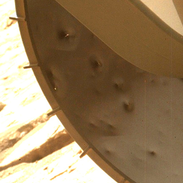 Detail of the inner edge of Curiosity’s front left wheel (contrast enhanced) — d