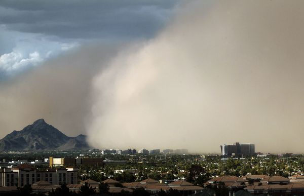 A massive cloud of dust looms over Phoenix, Arizona, during a dust storm in July