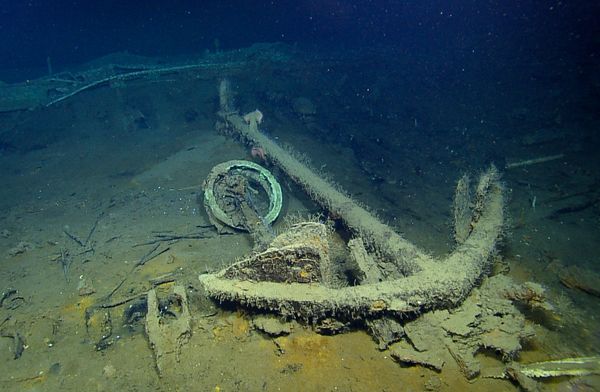 The anchor of a ship rests on the seafloor.