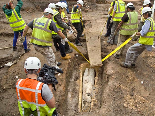 University of Leicester archaeologists lift the lid off of a stone coffin found