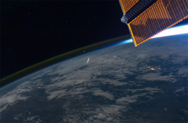 A perseid meteor is photographed by NASA astronaut Ron Garan from the Internatio