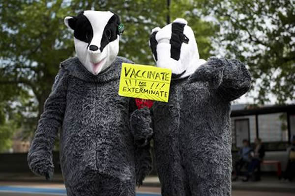 Hundreds of people wear black and white costumes to join the National March Agai