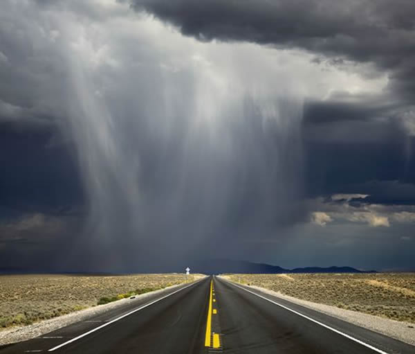 A storm crosses Highway 50 in the Nevada desert.