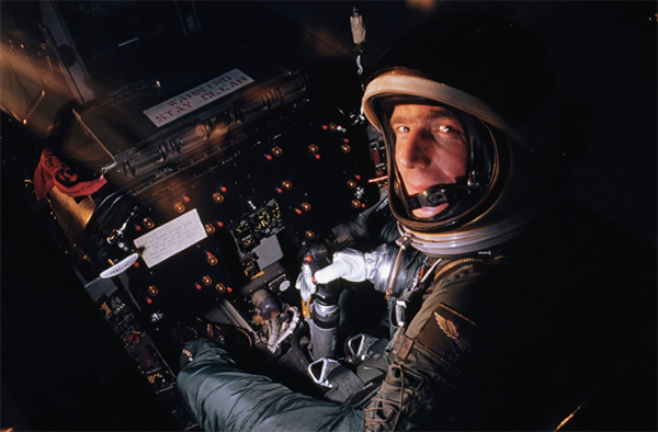 Mercury astronaut Scott Carpenter rides in a flight simulator at the astronaut t