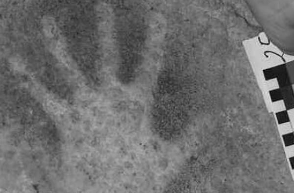 A close-up of one of the 30 hand stencils from El Castillo.