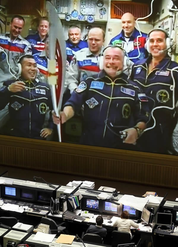 Russian specialists of the Mission Control Center in Korolyov, near Moscow, Russ