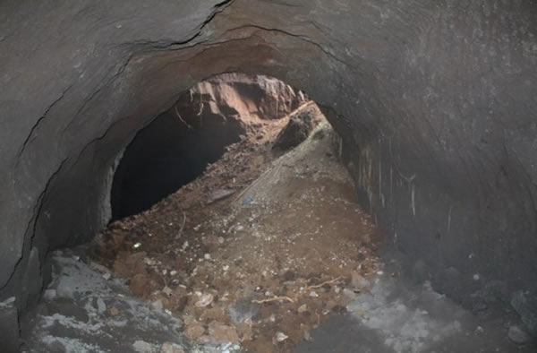 A collapsed quarry beneath Rome, caused by erosion and human activity above. The