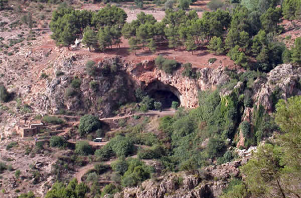 Grotte des Pigeons is seen from the surrounding hills.