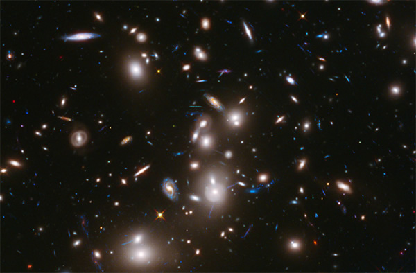 This long-exposure Hubble Space Telescope image of massive galaxy cluster Abell