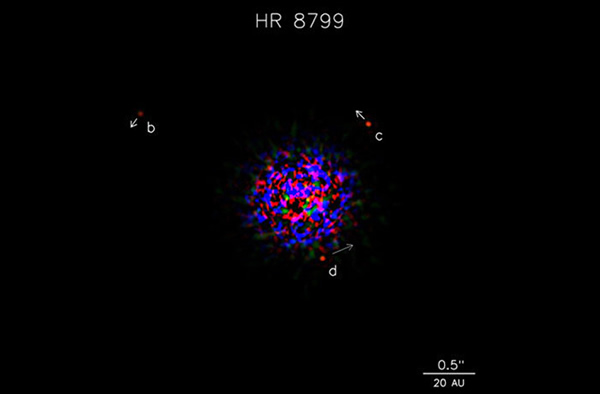 This image shows the star HR8799 in infrared light, along with three of its four