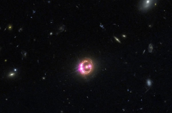 Multiple images of a distant quasar are visible in this combined view from NASA
