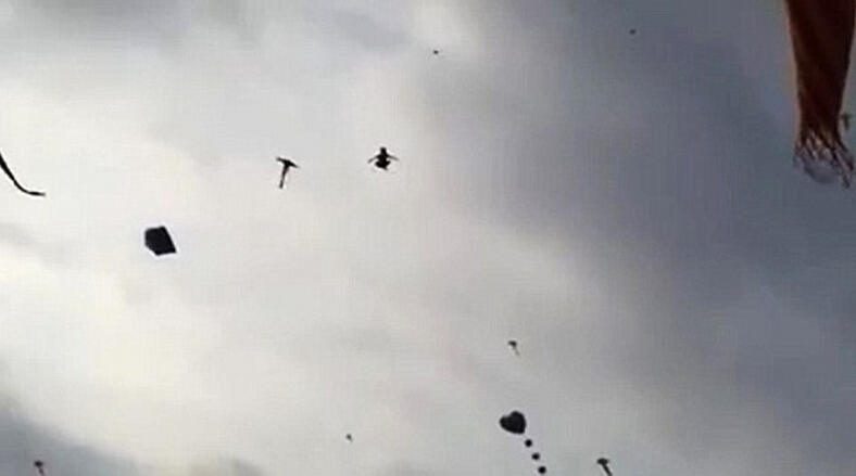 5岁男孩范明达当时正帮助母亲卖饮料,他的左腿被风筝线缠住,随后被风筝带入空中。