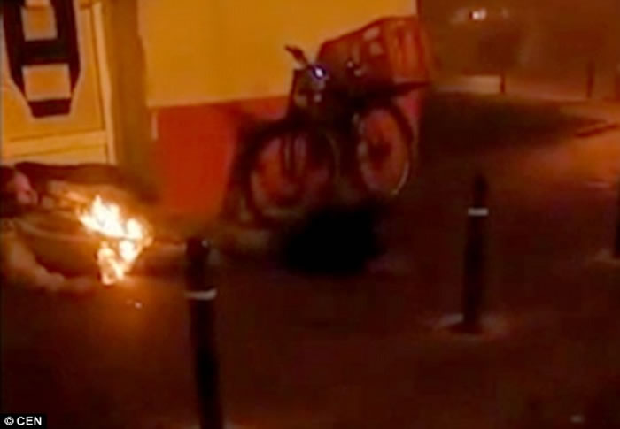 人体自燃首宗目击个案?塞尔维亚有人拍到一名男子躺在墙角上半身起火