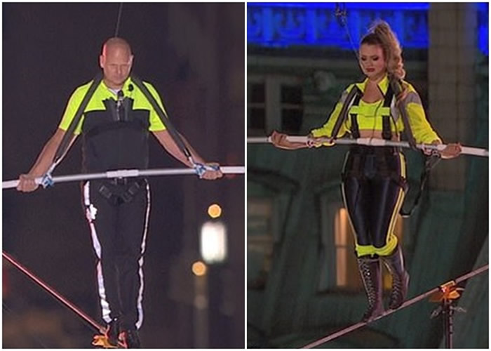 美国著名马戏团“飞翔瓦伦达家族”在纽约时代广场25层楼高度挑战踩钢线