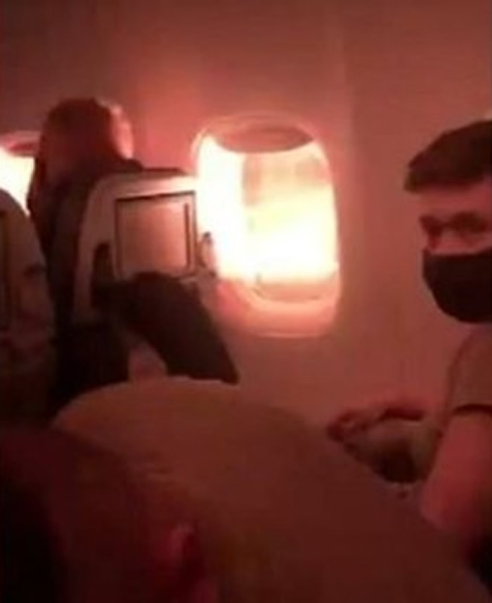 载有212名乘客的美军包机引擎故障 乘客拍下窗外冒出熊熊火光的恐怖画面