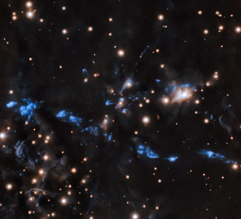 国际双子座天文台从拍摄的新图像中 蜿蜒的恒星喷流穿过一片恒星区域